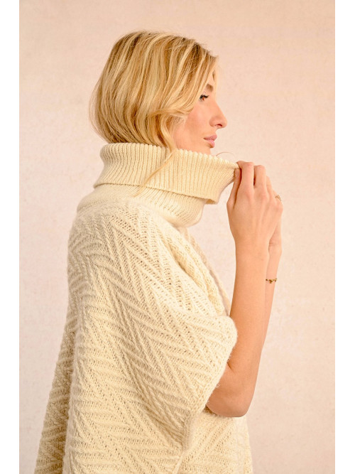 Poncho long frangé col roulé