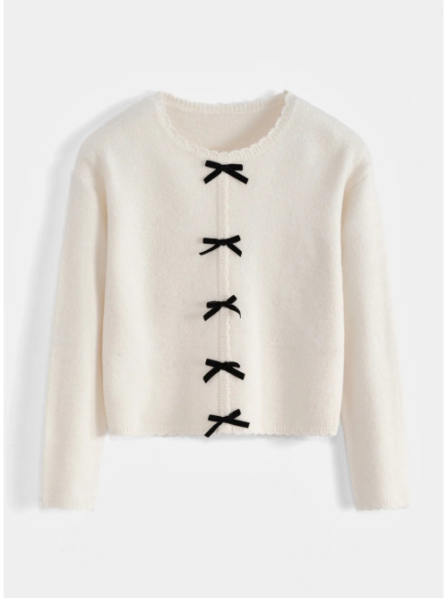 Pull bords festonnés et nœuds velours noirs